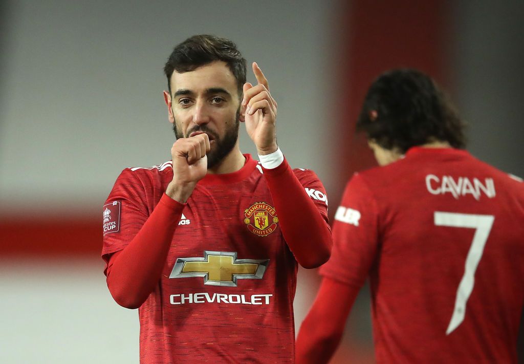 MANCHESTER, ENGLAND - JANUARY 24: Bruno Fernandes of Manchester United celebrates after scoring their sides third goal from a free kick during The Emirates FA Cup Fourth Round match between Manchester United and Liverpool at Old Trafford on January 24, 2021 in Manchester, England. Sporting stadiums around the UK remain under strict restrictions due to the Coronavirus Pandemic as Government social distancing laws prohibit fans inside venues resulting in games being played behind closed doors. (Photo by Martin Rickett - Pool/Getty Images)