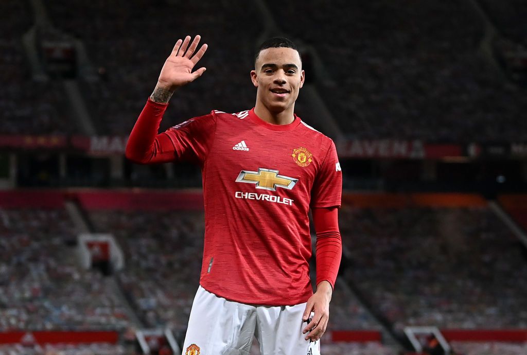 MANCHESTER, ENGLAND - JANUARY 24: Mason Greenwood of Manchester United celebrates after scoring their sides first goal  during The Emirates FA Cup Fourth Round match between Manchester United and Liverpool at Old Trafford on January 24, 2021 in Manchester, England. Sporting stadiums around the UK remain under strict restrictions due to the Coronavirus Pandemic as Government social distancing laws prohibit fans inside venues resulting in games being played behind closed doors. (Photo by Laurence Griffiths/Getty Images)