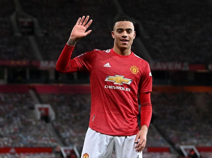 MANCHESTER, ENGLAND - JANUARY 24: Mason Greenwood of Manchester United celebrates after scoring their sides first goal  during The Emirates FA Cup Fourth Round match between Manchester United and Liverpool at Old Trafford on January 24, 2021 in Manchester, England. Sporting stadiums around the UK remain under strict restrictions due to the Coronavirus Pandemic as Government social distancing laws prohibit fans inside venues resulting in games being played behind closed doors. (Photo by Laurence Griffiths/Getty Images)