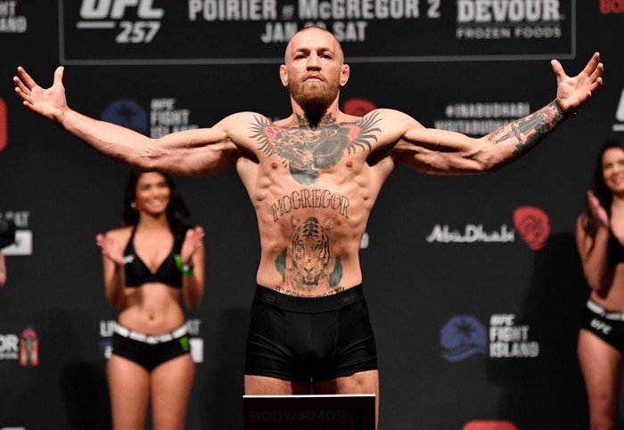 ABU DHABI, UNITED ARAB EMIRATES - JANUARY 22:  In this handout image provided by the UFC, Conor McGregor of Ireland poses on the scale during the UFC 257 weigh-in at Etihad Arena on UFC Fight Island on January 22, 2021 in Abu Dhabi, United Arab Emirates. (Photo by Jeff Bottari/Zuffa LLC via Getty Images)