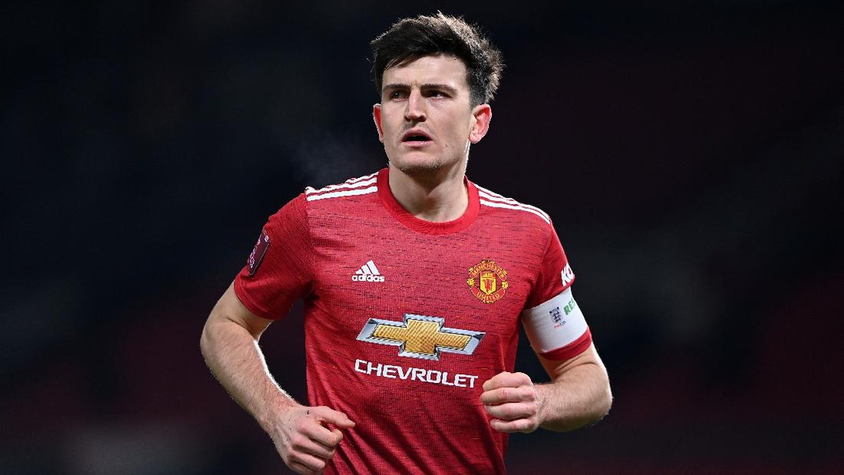 Harry Maguire menegaskan bahwa MU harus segera kembali meraih trofi demi pada fan (Foto: Getty Images/Laurence Griffiths)