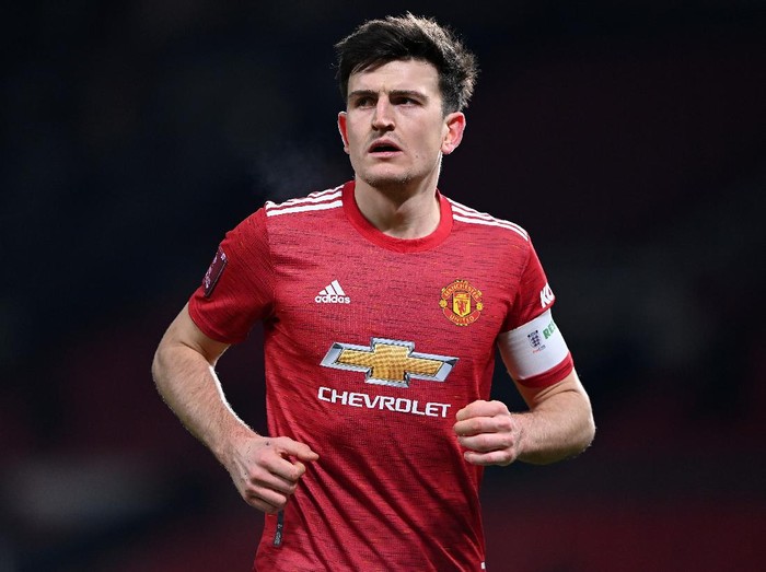 MANCHESTER, ENGLAND - JANUARY 24: Harry Maguire of Manchester United looks on during The Emirates FA Cup 4th Round match between Manchester United and Liverpool at Old Trafford on January 24, 2021 in Manchester, England. Sporting stadiums around the UK remain under strict restrictions due to the Coronavirus Pandemic as Government social distancing laws prohibit fans inside venues resulting in games being played behind closed doors. (Photo by Laurence Griffiths/Getty Images)