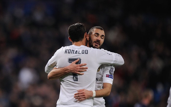 MADRID, SPAIN - DECEMBER 08:  Cristiano Ronaldo of Real Madrid celebrates with Karim Benzema after scoring Reals 6th goal during the UEFA Champions League Group A match between Real Madrid CF and Malmo FF at the Santiago Bernabeu stadium on December 8, 2015 in Madrid, Spain.  (Photo by Denis Doyle/Getty Images)