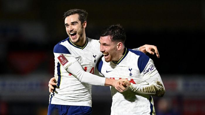 Tottenham Hotspur HIGH WYCOMBE, ENGLAND - JANUARY 25: Harry Winks of Tottenham Hotspur celebrates after scoring their sides second goal with team mate Pierre-Emile Højbjerg during The Emirates FA Cup Fourth Round match between Wycombe Wanderers and Tottenham Hotspur at Adams Park on January 25, 2021 in High Wycombe, England. Sporting stadiums around the UK remain under strict restrictions due to the Coronavirus Pandemic as Government social distancing laws prohibit fans inside venues resulting in games being played behind closed doors. (Photo by Shaun Botterill/Getty Images)