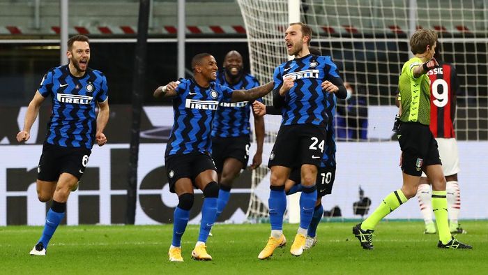 Christian Eriksen MILAN, ITALY - JANUARY 26: Christian Eriksen of FC Internazionale celebrates with team mate Ashley Young after scoring their teams second goal during the Coppa Italia match between FC Internazionale and AC Milan at Stadio Giuseppe Meazza on January 26, 2021 in Milan, Italy. Sporting stadiums around Italy remain under strict restrictions due to the Coronavirus Pandemic as Government social distancing laws prohibit fans inside venues resulting in games being played behind closed doors. (Photo by Marco Luzzani/Getty Images)