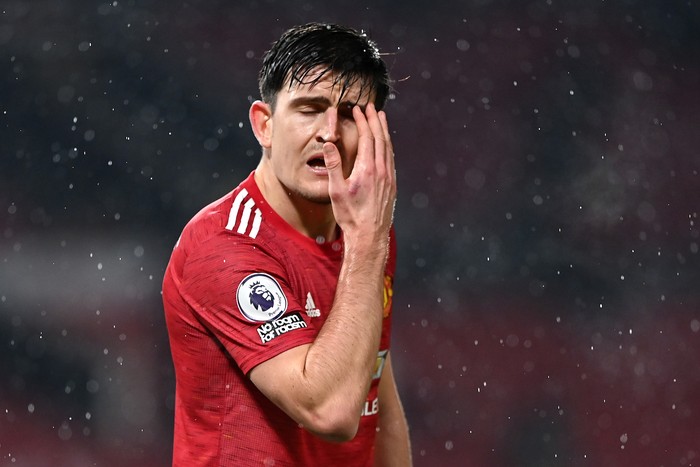 MANCHESTER, ENGLAND - JANUARY 27: Harry Maguire of Manchester United reacts during the Premier League match between Manchester United and Sheffield United at Old Trafford on January 27, 2021 in Manchester, England. Sporting stadiums around the UK remain under strict restrictions due to the Coronavirus Pandemic as Government social distancing laws prohibit fans inside venues resulting in games being played behind closed doors. (Photo by Laurence Griffiths/Getty Images)