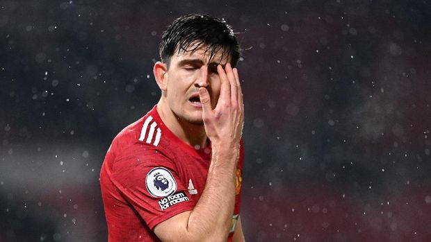 MANCHESTER, ENGLAND - JANUARY 27: Harry Maguire of Manchester United reacts during the Premier League match between Manchester United and Sheffield United at Old Trafford on January 27, 2021 in Manchester, England. Sporting stadiums around the UK remain under strict restrictions due to the Coronavirus Pandemic as Government social distancing laws prohibit fans inside venues resulting in games being played behind closed doors. (Photo by Laurence Griffiths/Getty Images)