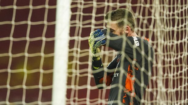 Manchester United's goalkeeper David de Gea reacts after Sheffield United's Kean Bryan scored during the English Premier League soccer match between Manchester United and Sheffield United at Old Trafford, Manchester, England, Wednesday, Jan. 27, 2021. (AP Photo/Dave Thompson,Pool)