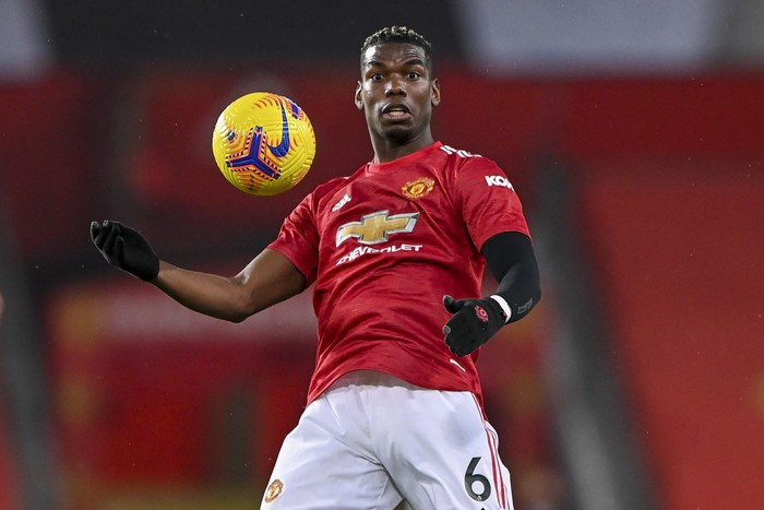 Manchester Uniteds Paul Pogba attempts to control the ball during the English Premier League soccer match between Manchester United and Sheffield United at Old Trafford, Manchester, England, Wednesday, Jan. 27, 2021. (AP Photo/Laurence Griffiths,Pool)