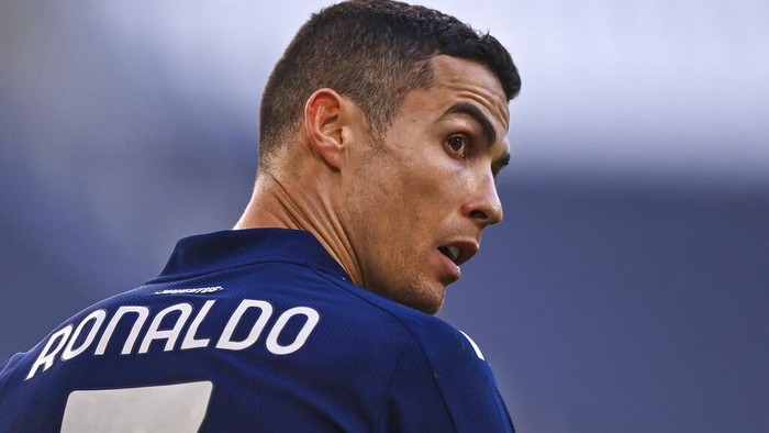 Juventus Cristiano Ronaldo gloms back during the Serie A soccer match between Juventus and Bologna, at the Allianz Stadium in Turin, Italy, Sunday, Jan. 24, 2021. (Fabio Ferrari/LaPresse via AP)