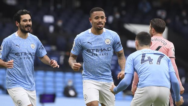 Manchester City's Gabriel Jesus, center, celebrates after scoring his side's opening goal during the English Premier League match between Manchester City and Sheffield United at the the City of Manchester Stadium in Manchester, England, Saturday, Jan. 30, 2021. (Michael Regan/Pool via AP)
