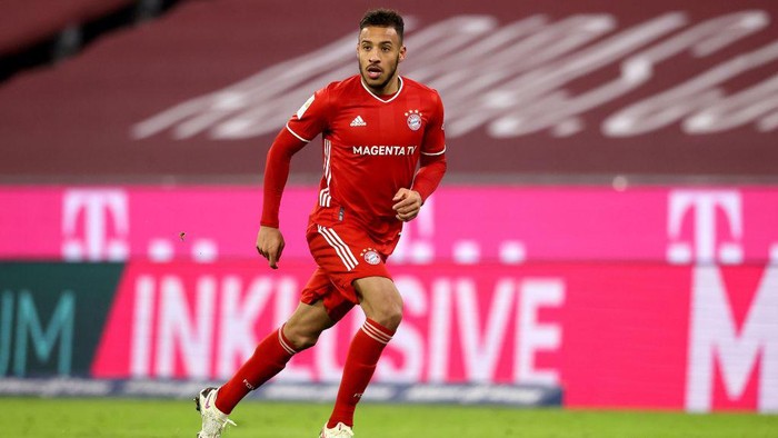 MUNICH, GERMANY - DECEMBER 16: Corentin Tolisso of FC Bayern München runs with the ball during the Bundesliga match between FC Bayern Muenchen and VfL Wolfsburg at Allianz Arena on December 16, 2020 in Munich, Germany. (Photo by Alexander Hassenstein/Getty Images)