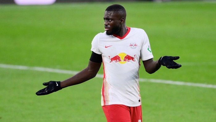 LEIPZIG, GERMANY - DECEMBER 19: Dayot Upamecano of RB Leipzig looks dejected during the Bundesliga match between RB Leipzig and 1. FC Koeln at Red Bull Arena on December 19, 2020 in Leipzig, Germany. Sporting stadiums around Germany remain under strict restrictions due to the Coronavirus Pandemic as Government social distancing laws prohibit fans inside venues resulting in games being played behind closed doors. (Photo by Oliver Hardt/Getty Images)