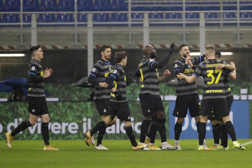 Inter Milan players celebrate a goal against Benevento during a Serie A soccer match between Inter Milan and Benevento at the San Siro stadium in Milan, Italy, Saturday, Jan. 30, 2021. (AP Photo/Luca Bruno)