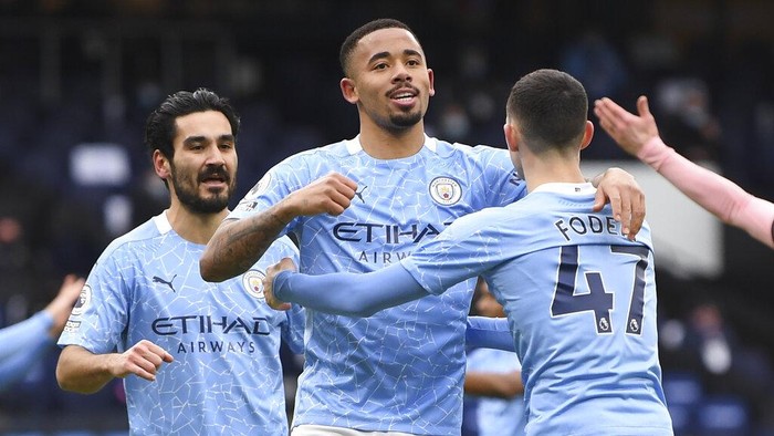 Manchester Citys Gabriel Jesus, center, celebrates after scoring his sides opening goal during the English Premier League match between Manchester City and Sheffield United at the the City of Manchester Stadium in Manchester, England, Saturday, Jan. 30, 2021. (Michael Regan/Pool via AP)