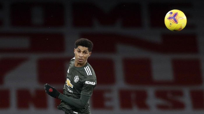 Manchester Uniteds Marcus Rashford heads the ball during the English Premier League soccer match between Arsenal and Manchester United at the Emirates stadium in London, Saturday, Jan. 30, 2021. (AP Photo/Alastair Grant, Pool)