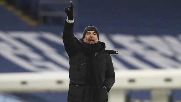 Manchester Citys head coach Pep Guardiola yells during the English Premier League match between Manchester City and Sheffield United at the the City of Manchester Stadium in Manchester, England, Saturday, Jan. 30, 2021. (Martin Rickett/Pool via AP)
