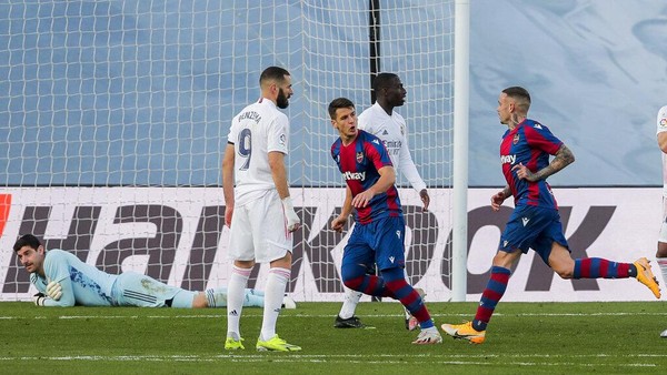 Levantes Roger Marti, right, celebrates after scoring his team second goal during the Spanish La Liga soccer match between Real Madrid and Levante at the Alfredo Di Stefano stadium in Madrid, Spain, Saturday, Jan. 30, 2021. (AP Photo/Manu Fernandez)