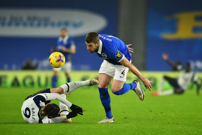 BRIGHTON, ENGLAND - JANUARY 31: Adam Webster of Brighton & Hove Albion battles for possession with Gareth Bale of Tottenham Hotspur during the Premier League match between Brighton & Hove Albion and Tottenham Hotspur at American Express Community Stadium on January 31, 2021 in Brighton, England. Sporting stadiums around the UK remain under strict restrictions due to the Coronavirus Pandemic as Government social distancing laws prohibit fans inside venues resulting in games being played behind closed doors. (Photo by Glyn Kirk - Pool/Getty Images)