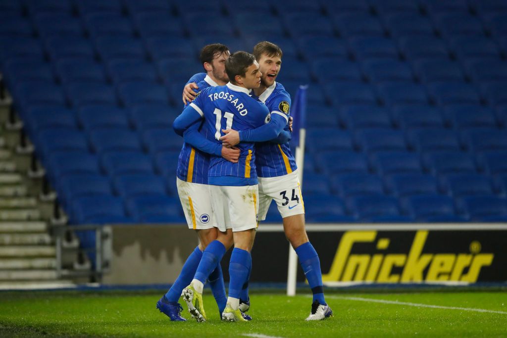 BRIGHTON, ENGLAND - JANUARY 31: Leandro Trossard of Brighton & Hove Albion celebrates with team mates (L - R) Pascal Gross and Joel Veltman after scoring their side's first goal during the Premier League match between Brighton & Hove Albion and Tottenham Hotspur at American Express Community Stadium on January 31, 2021 in Brighton, England. Sporting stadiums around the UK remain under strict restrictions due to the Coronavirus Pandemic as Government social distancing laws prohibit fans inside venues resulting in games being played behind closed doors. (Photo by Andrew Boyers - Pool/Getty Images)