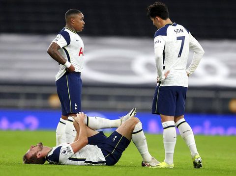 Tottenham's Harry Kane lies injured on the pitch during the English Premier League soccer match between Tottenham Hotspur and Liverpool at the Tottenham Hotspur Stadium in London, Thursday, Jan. 28, 2021. (Catherine Ivill/Pool via AP)