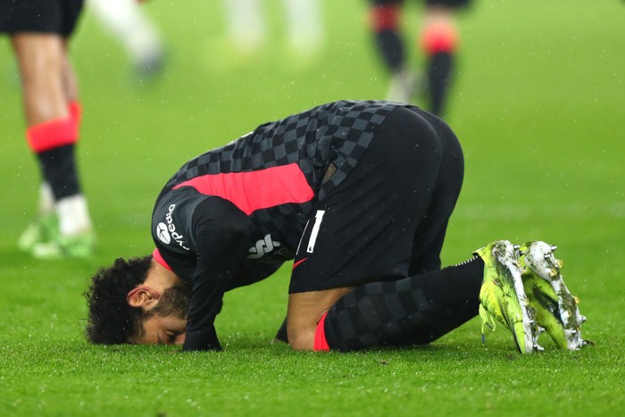 LONDON, ENGLAND - JANUARY 31: Mohamed Salah of Liverpool celebrates after scoring their sides second goal during the Premier League match between West Ham United and Liverpool at London Stadium on January 31, 2021 in London, England. Sporting stadiums around the UK remain under strict restrictions due to the Coronavirus Pandemic as Government social distancing laws prohibit fans inside venues resulting in games being played behind closed doors. (Photo by Clive Rose/Getty Images)