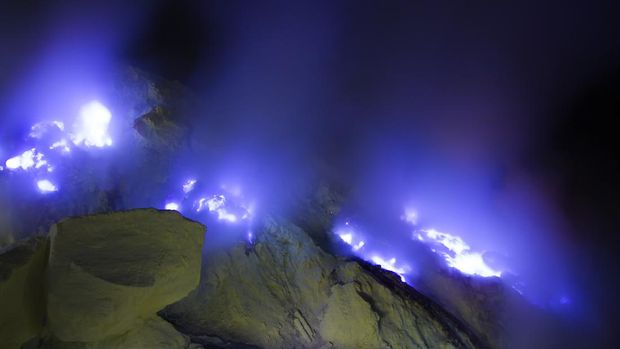 Kawah Ijen volcano, East Java - blue sulfur flames.