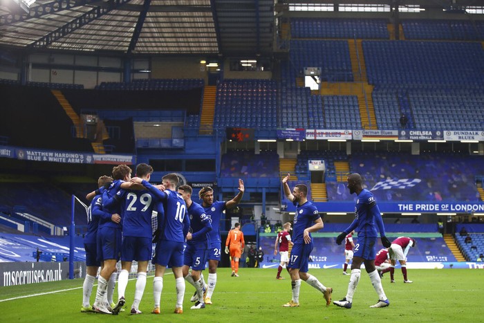 Chelsea players celebrate after Marcos Alonso scored his sides second goal during the English Premier League soccer match between Chelsea and Burnley at Stamford Bridge Stadium in London, England, Sunday, Jan. 31, 2021.(Julian Finney/Pool Via AP)