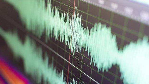 Blue wireframe ear with noisy distorted sound waves - 3D illustration