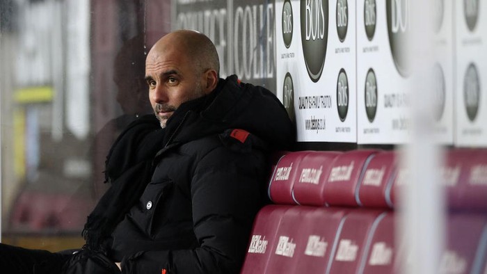 BURNLEY, ENGLAND - FEBRUARY 03: Pep Guardiola, Manager of Manchester City looks on ahead of the Premier League match between Burnley and Manchester City at Turf Moor on February 03, 2021 in Burnley, England. Sporting stadiums around the UK remain under strict restrictions due to the Coronavirus Pandemic as Government social distancing laws prohibit fans inside venues resulting in games being played behind closed doors. (Photo by Martin Rickett - Pool/Getty Images)