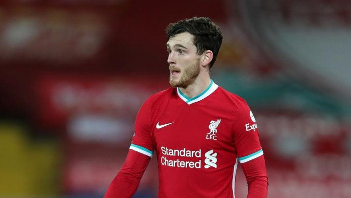 LIVERPOOL, ENGLAND - FEBRUARY 03: Andy Robertson of Liverpool in action during the Premier League match between Liverpool and Brighton & Hove Albion at Anfield on February 03, 2021 in Liverpool, England. Sporting stadiums around the UK remain under strict restrictions due to the Coronavirus Pandemic as Government social distancing laws prohibit fans inside venues resulting in games being played behind closed doors. (Photo by Clive Brunskill/Getty Images)