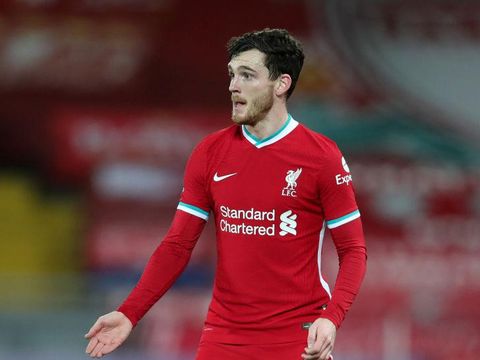 LIVERPOOL, ENGLAND - FEBRUARY 03: Andy Robertson of Liverpool in action during the Premier League match between Liverpool and Brighton & Hove Albion at Anfield on February 03, 2021 in Liverpool, England. Sporting stadiums around the UK remain under strict restrictions due to the Coronavirus Pandemic as Government social distancing laws prohibit fans inside venues resulting in games being played behind closed doors. (Photo by Clive Brunskill/Getty Images)
