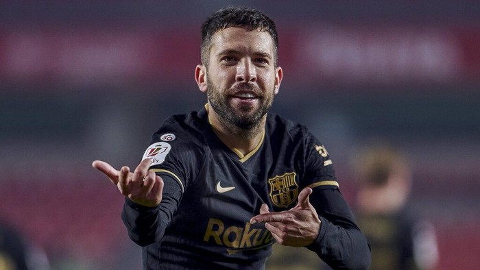 Barcelonas Jordi Alba celebrates after scoring his sides fifth goal during a Spanish Copa del Rey quarter finals soccer match between Granada and FC Barcelona at the Los Carmenes stadium in Granada, Spain, Wednesday, Feb. 3, 2021. (AP Photo)