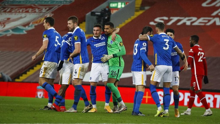 Brighton players celebrate at the end of the English Premier League soccer match between Liverpool and Brighton at Anfield stadium, in Liverpool, England, Wednesday, Feb. 3, 2021. Brighton won 1-0. (Phil Noble/Pool via AP)