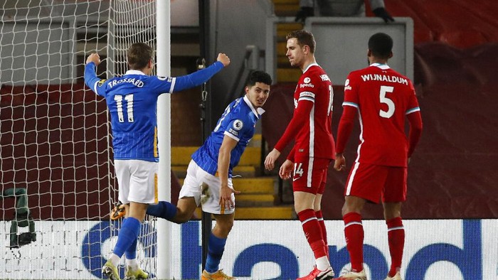 Brightons Steven Alzate, center, celebrates after scoring his sides first goal during the English Premier League soccer match between Liverpool and Brighton at Anfield stadium, in Liverpool, England, Wednesday, Feb. 3, 2021. (Phil Noble/Pool via AP)