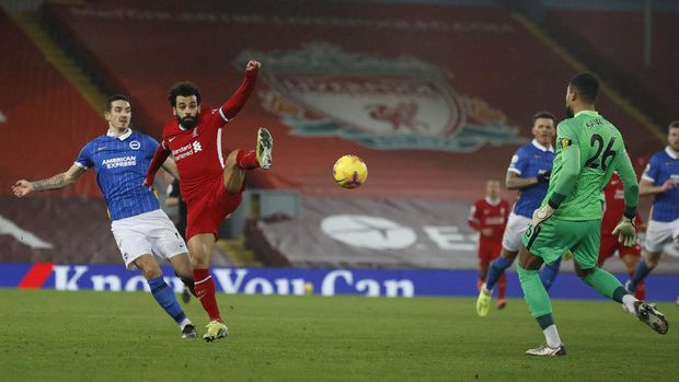 Brighton's goalkeeper Robert Sanchez saves on an attempt to score by Liverpool's Mohamed Salah, left, during the English Premier League soccer match between Liverpool and Brighton at Anfield stadium, in Liverpool, England, Wednesday, Feb. 3, 2021(Phil Noble/Pool via AP)