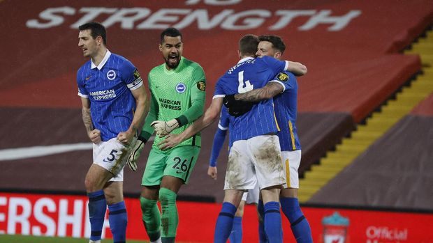 Brighton players celebrate at the end of the English Premier League soccer match between Liverpool and Brighton at Anfield stadium, in Liverpool, England, Wednesday, Feb. 3, 2021. Brighton won 1-0. (Phil Noble/Pool via AP)
