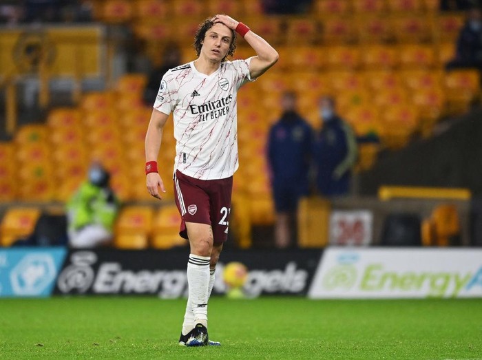 WOLVERHAMPTON, ENGLAND - FEBRUARY 02: David Luiz of Arsenal reacts as he walks off the pitch after being shown a red card during the Premier League match between Wolverhampton Wanderers and Arsenal at Molineux on February 02, 2021 in Wolverhampton, England. Sporting stadiums around the UK remain under strict restrictions due to the Coronavirus Pandemic as Government social distancing laws prohibit fans inside venues resulting in games being played behind closed doors. (Photo by Shaun Botterill/Getty Images)