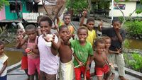 Senyum Dunia Bermain Anak-anak Ewer dan Suku Asmat