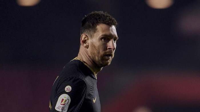 Barcelonas Lionel Messi looks on during a Spanish Copa del Rey quarter finals soccer match between Granada and FC Barcelona at the Los Carmenes stadium in Granada, Spain, Wednesday, Feb. 3, 2021. (AP Photo)