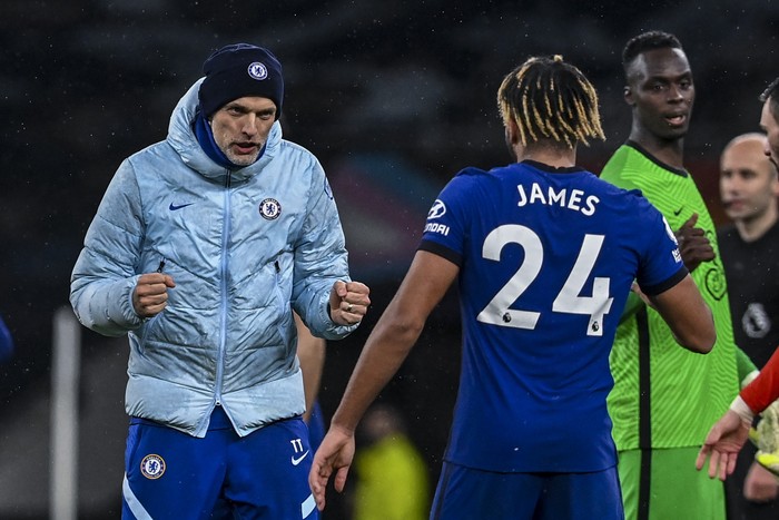 Chelsea's German head coach Thomas Tuchel, left, celebrates after the English Premier League soccer match between Tottenham and Chelsea at the Tottenham Hotspur Stadium in London, England, Thursday, Feb. 4, 2021.(Neil Hall/Pool via AP)