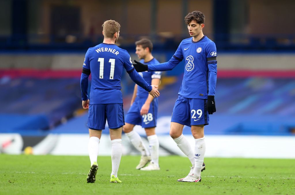 LONDON, ENGLAND - JANUARY 31: Kai Havertz of Chelsea interacts with team mate Timo Werner following the Premier League match between Chelsea and Burnley at Stamford Bridge on January 31, 2021 in London, England. Sporting stadiums around the UK remain under strict restrictions due to the Coronavirus Pandemic as Government social distancing laws prohibit fans inside venues resulting in games being played behind closed doors. (Photo by Julian Finney/Getty Images)