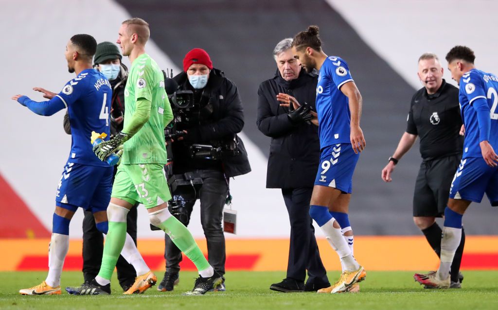 MANCHESTER, ENGLAND - FEBRUARY 06: Carlo Ancelotti, Manager of Everton embraces Dominic Calvert-Lewin of Everton at full-time after the Premier League match between Manchester United and Everton at Old Trafford on February 06, 2021 in Manchester, England. Sporting stadiums around the UK remain under strict restrictions due to the Coronavirus Pandemic as Government social distancing laws prohibit fans inside venues resulting in games being played behind closed doors. (Photo by Alex Pantling/Getty Images)