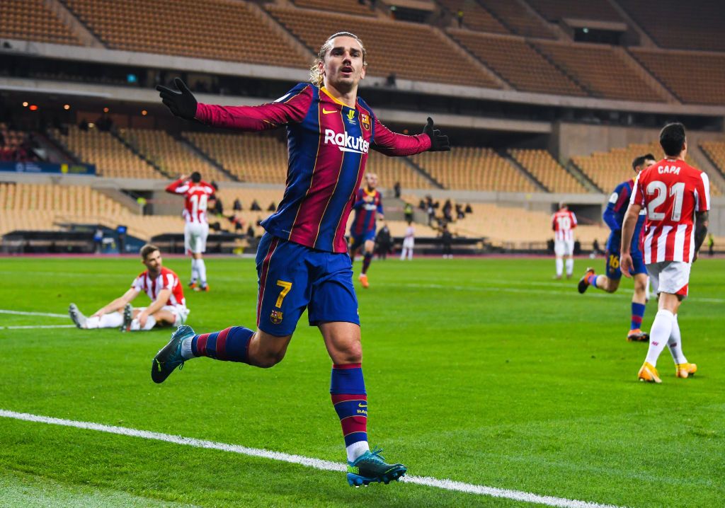 SEVILLE, SPAIN - JANUARY 17: Antoine Griezmann of FC Barcelona celebrates after scoring his team's second goal during the Supercopa de Espana Final match between FC Barcelona and Athletic Club at Estadio de La Cartuja on January 17, 2021 in Seville, Spain. Sporting stadiums around Spain remain under strict restrictions due to the Coronavirus Pandemic as Government social distancing laws prohibit fans inside venues resulting in games being played behind closed doors. (Photo by David Ramos/Getty Images)