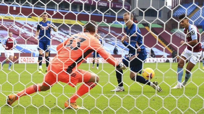 Aston Villas Ollie Watkins, right, scores his sides opening goal during the English Premier League soccer match between Aston Villa and Arsenal at Villa Park in Birmingham, England, Saturday, Feb. 6, 2021. (Nick Potts, Pool via AP)