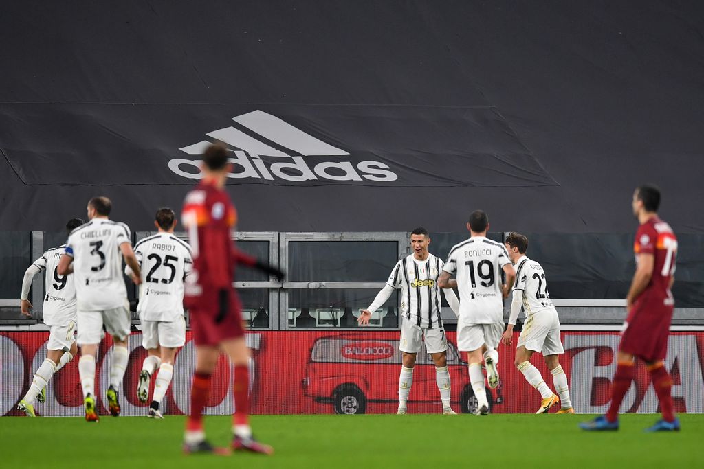 TURIN, ITALY - FEBRUARY 6: Cristiano Ronaldo of Juventus celebrates with his teammates after scoring his team's first goal during the Serie A match between Juventus and AS Roma at Allianz Stadium on February 6, 2021 in Turin, Italy.  Italy's sports stadiums remain under strict restrictions due to the coronavirus pandemic, as the government's social distancing laws prohibit fans within venues, causing games to be played behind closed doors.  (Photo by Valerio Pennicino / Getty Images)