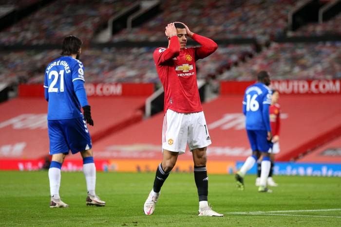 MANCHESTER, ENGLAND - FEBRUARY 06: Mason Greenwood of Manchester United reacts after a missed chance during the Premier League match between Manchester United and Everton at Old Trafford on February 06, 2021 in Manchester, England. Sporting stadiums around the UK remain under strict restrictions due to the Coronavirus Pandemic as Government social distancing laws prohibit fans inside venues resulting in games being played behind closed doors. (Photo by Alex Pantling/Getty Images)