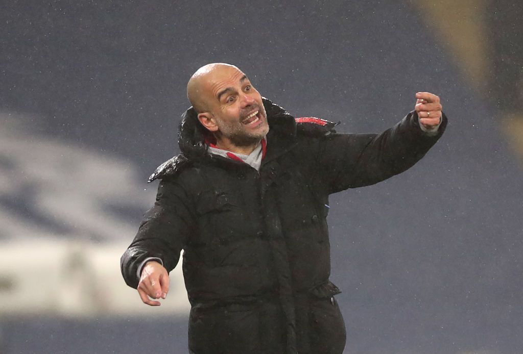 MANCHESTER, ENGLAND - JANUARY 13: Manager of Manchester City, Pep Guardiola gives their team instructions during the Premier League match between Manchester City and Brighton & Hove Albion at Etihad Stadium on January 13, 2021 in Manchester, England. Sporting stadiums around England remain under strict restrictions due to the Coronavirus Pandemic as Government social distancing laws prohibit fans inside venues resulting in games being played behind closed doors. (Photo by Clive Brunskill/Getty Images)