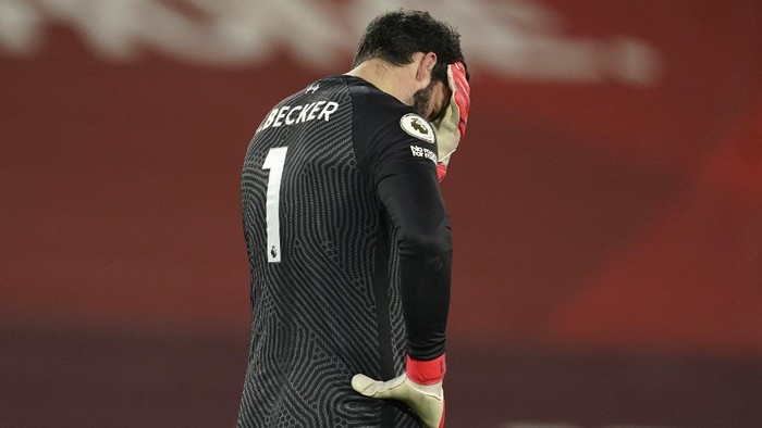 Liverpools goalkeeper Alisson reacts after Manchester Citys Raheem Sterling scored his sides third goal during the English Premier League soccer match between Liverpool and Manchester City at Anfield Stadium, Liverpool, England, Sunday, Feb. 7, 2021. (AP photo/Jon Super, Pool)