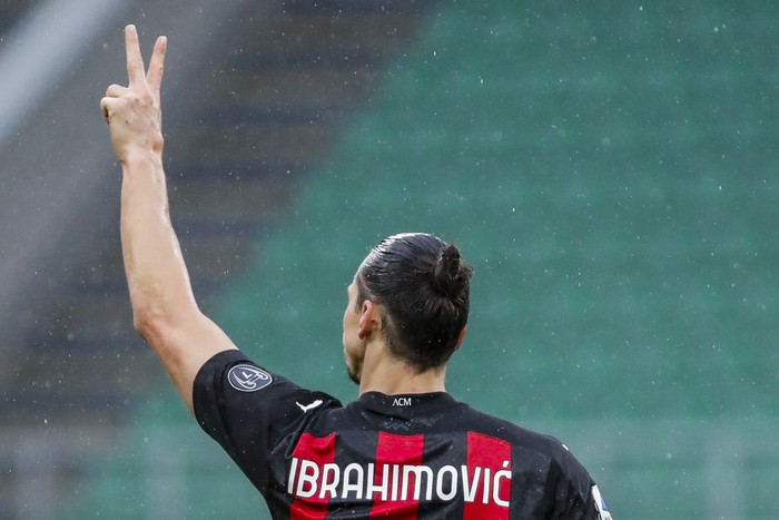 AC Milans Zlatan Ibrahimovic celebrates after scoring the opening goal during the Serie A soccer match between AC Milan and Crotone at the San Siro stadium in Milan, Italy, Sunday, Feb. 7, 2021. (AP Photo/Antonio Calanni)